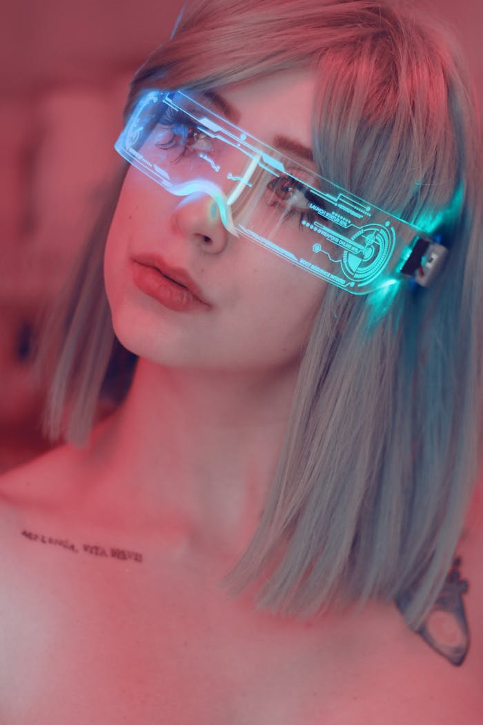 Portrait of a young woman wearing neon light glasses, conveying a futuristic and stylish vibe.